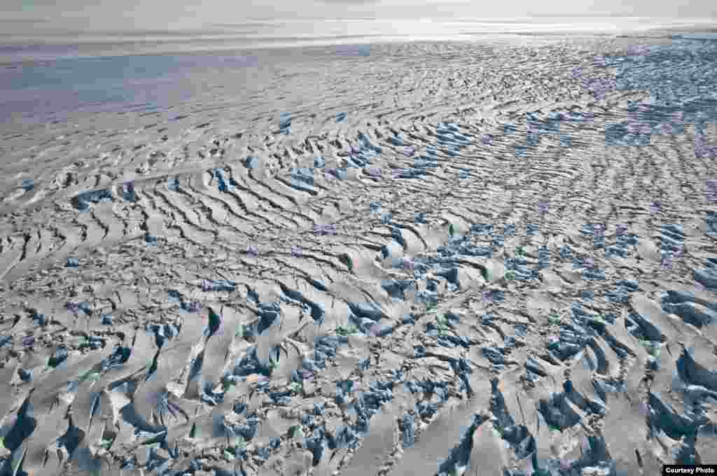 Close-up of large crevasses produced by Pine Island Glacier’s rapidly stretching ice just above its grounding line (the transition from grounded to floating ice). (Photo courtesy Ian Joughin)