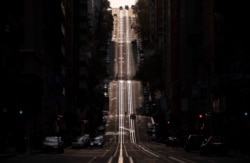 FILE - California Street, usually filled with cable cars, is seen empty in San Francisco, Calif., on March 18, 2020, amid the COVID-19 pandemic.