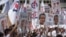 Supporters of the ruling People's Action Party (PAP), cheer their party leaders at a nomination center, Tuesday, Sept. 1, 2015.