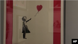 Lukisan "Girl with Balloon" karya Banksy