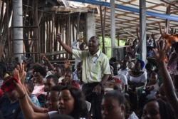 Belivers attend the Sunday Mass without wearing masks and social distancing at Ufunuo na Uzima Church in Dar es Salaam, Feb. 7, 2021.