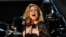 FILE - Adele performs "Rolling in the Deep" at the 54th annual Grammy Awards in Los Angeles, Calif.