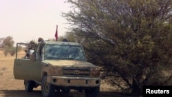 People watch the first sunrise on New Year&#39;s Day at Yuriage district in Natori, Miyagi prefecture, Japan, in this photo taken by Kyodo.
