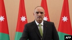 A handout picture released by the Jordanian Royal Palace on Oct. 12, 2020, shows Bisher al-Khasawneh being sworn in as the new Prime Minister in the capital Amman.