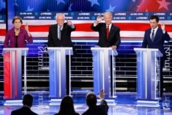 FILE - From left, candidates Sen. Elizabeth Warren, Sen. Bernie Sanders, former Vice President Joe Biden, and Pete Buttigieg, participate in a Democratic presidential primary debate, Feb. 19, 2020, in Las Vegas.