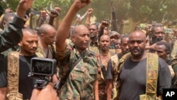 FILE - In this photo released by the Sudanese Army on May 30, 2023, Gen. Abdel-Fattah Burhan visits the troops in Khartoum, Sudan. 