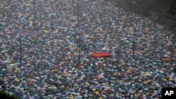 FILE - Protesters gather on Victoria Park in Hong Kong, Aug. 18, 2019. 