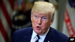 FILE - President Donald Trump speaks during round-table talks on sanctuary cities with law enforcement officers in the Roosevelt Room of the White House, in Washington, March 20, 2018. 