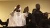 FILE - Chad's former dictator Hissene Habre raises his hands after sentencing during court proceedings in Dakar, Senegal, May 30, 2016. 