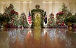 Holiday decor adorns the Cross Hall of the White House in Washington, Nov. 30, 2020.