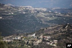 FILE -- A view toward the Turkish border from Kinsibba, Syria.