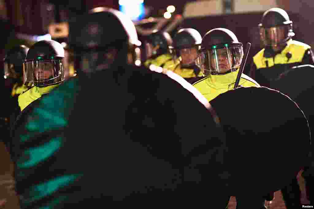 Riot police clear roads after clashes with demonstrators in the streets near the Turkish consulate in Rotterdam, Netherlands, March 11, 2017.