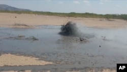 In this image taken from video, mud bubbles up near volcanic activity in the Sagento Kebele Village, Afar region, Ethiopia, on Jan. 4, 2025. 