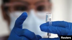 FILE - A nurse draws from a vial of Johnson & Johnson coronavirus vaccine, in Los Angeles, California, March 25, 2021. 