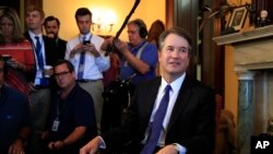 Supreme Court nominee Brett Kavanaugh listens to Sen. Rob Portman, R-Ohio, on Capitol Hill in Washington, during a meeting, July 11, 2018.