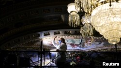 Restoration work is done on the ceiling inside the Senate reception room while the Senate works to finalize the bipartisan infrastructure deal at the U.S. Capitol in Washington, Aug. 5, 2021. 