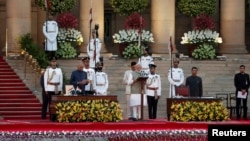 India's President Ram Nath Kovind administers Amit Shah's oath of office during a swearing-in ceremony at the presidential palace in New Delhi, India, May 30, 2019.