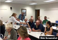 Democratic Sen. Heidi Heitkamp of North Dakota, left, in white, spoke recently to Valley City farmers and small-business owners at an economic roundtable.