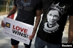 FILE - A man wears a T-shirt showing U.S. Supreme Court Justice Ruth Bader Ginsburg as "Notorious R.B.G." at a celebration rally in West Hollywood, Calif., June 26, 2015. The U.S. Supreme Court had ruled that the U.S. Constitution provides same-sex couples the right to marry, in a historic triumph for the American gay rights movement.