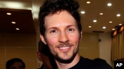 FILE - In this Aug. 1, 2017 photo, Telegram co-founder Pavel Durov smiles following his meeting with Indonesian Communication and Information Minister Rudiantara in Jakarta, Indonesia.