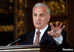 FILE - Minnesota Gov. Mark Dayton speaks to media in St. Paul, Minnesota, July 20, 2011.