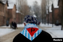 A survivor is seen at the former Nazi German concentration and extermination camp Auschwitz, as he attends ceremonies marking the 74th anniversary of the liberation of the camp and International Holocaust Victims Remembrance Day, in Oswiecim, Poland, Jan. 27, 2019.