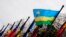 FILE - The national flag of Rwanda flies amongst other flags.