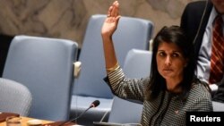 U.S. Ambassador to the U.N. Nikki Haley votes for a draft resolution condemning the reported use of chemical weapons in Syria at the Security Council meeting on the situation in Syria at the United Nations Headquarters in New York, April 12, 2017. 