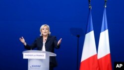 French far-right presidential candidate Marine Le Pen attends her meeting, May 1, 2017, in Villepinte, outside Paris. 