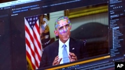 This image made from video of a fake video featuring former President Barack Obama shows elements of facial mapping used in new technology that lets anyone make videos of real people appearing to say things they've never said. (AP Photo)