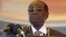 FILE: President Robert Mugabe waits to address crowds gathered for Zimbabwe's Heroes Day commemorations in Harare, August 10, 2015.