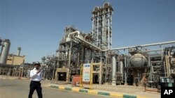 Petrochemical plant at an Iranian port. (2011 photo) New sanctions target Iran's oil-dependent economy