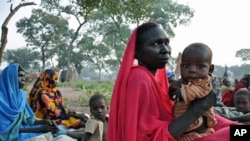 Refugees wait for food aid to be distributed near the volatile border with the north, in Yida refugee camp in South Sudan, November 16, 2011.