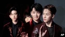 Members of South Korean music band GOT7 pose for photos on the red carpet of the Mnet Asian Music Awards (MAMA) in Hong Kong, Friday, Dec. 14, 2018.