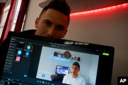 Julio Aguirre Lusson, 25, a DJ who has had a YouTube channel called TecnoLikeCuba for a year, poses for a photo at his home in Havana, Cuba, Feb. 20, 2019.