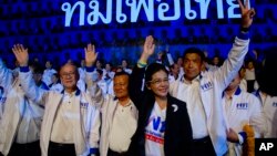 Sudarat Keyuraphan, leader of the Pheu Thai Party and a candidate for prime minister, second right, and contestants wave during a rally ahead of general elections in Bangkok, Thailand, March 22, 2019.