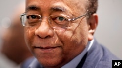 Mohammed “Mo” Ibrahim poses for photographs before speaking at the launch of the Mo Ibrahim Foundation in London, Friday Oct. 27, 2006.