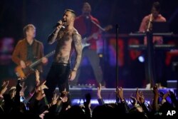 Adam Levine of Maroon 5 performs during halftime of the NFL Super Bowl 53 football game between the Los Angeles Rams and the New England Patriots Sunday, Feb. 3, 2019, in Atlanta.