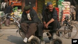 A worker stands ready to clean as waterparks reopened amid concerns of the spread of COVID-19, at the city-owned waterpark in Grand Prairie, Texas.
