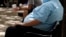 FILE - An overweight man rests on a bench in Jackson, Mississippi. Rising numbers of American adults have the most dangerous kind of obesity, belly fat, despite evidence that overall obesity rates may have plateaued, government data shows. 
