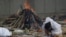Flames Rise from Funeral Pyres as Indian Families Mourn COVID Victims 