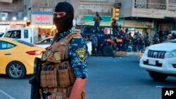Iraqi Federal police are deployed in Sadr City, Baghdad, Iraq, Oct. 7, 2019. 