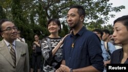 Activist and Civic Party member Ken Tsang Kin-chiu arrives to report the Central Police Station in Hong Kong, Oct. 15, 2015, on the charges of obstructing and assaulting police officers during the Occupy movement a year ago. Seven police officers have been charged in relation to the beating of Tsang.