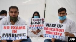 Activists of the National Students Union of India (NSUI) stage a protest in front of the NSUI headquarters in New Delhi, India, Aug. 26, 2020, demanding the government postpone entrance exams.