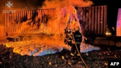 FILE - Firefighters work to extinguish a fire on the port infrastructure on the Danube River, in Ukraine's Odesa region, Oct. 6, 2023, amid Russia's invasion of Ukraine. (Ukrainian Emergency Service via AFP)