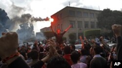 Students rally condemning the dismissal of the murder case against toppled president Hosni Mubarak over the killing of protesters during Egypt’s 2011 uprising, at Cairo University, Egypt, Nov. 30, 2014.