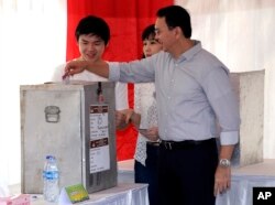 Jakarta Governor Basuki "Ahok" Tjahaja Purnama who is seeking his second term in office, files his ballot at a polling station during the runoff election in Jakarta, Indonesia, April 19, 2017.