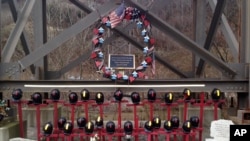 FILE - A memorial to 29 miners killed in an April 2010 explosion is shown Dec. 3, 2015, at the entrance to the Upper Big Branch mine in Montcoal, West Virginia. Don Blankenship, former CEO of Massey Energy, was convicted of conspiring to willfully violate