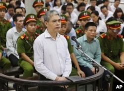 Nguyen Xuan Son, former general director of Ocean Bank, appears in a court in Hanoi, Vietnam, Monday, Aug. 28, 2017. Son and 50 bankers and business executives were put on trial Monday for alleged graft and mismanagement causing $69 million in losses to the bank.