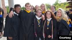 FILE -- Friends pose together at their graduation from Merrimack College in North Andover, Massachusetts. (Photo by Flickr user Merrimack College via Creative Commons license.)